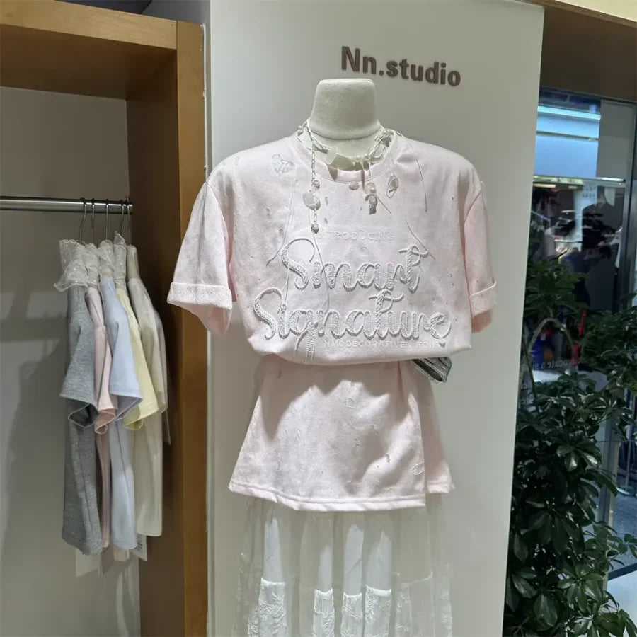 A137 - SS26 Designer Series: Intricate Lace & Embroidery Distressed Oversized Tee